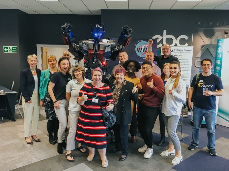 Client team with invited robot at WINN Great Things event in Worcestershire.