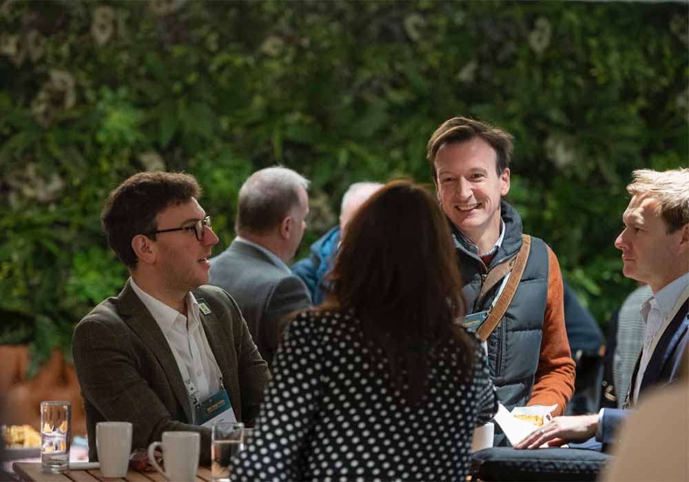 People shaking hands at an event