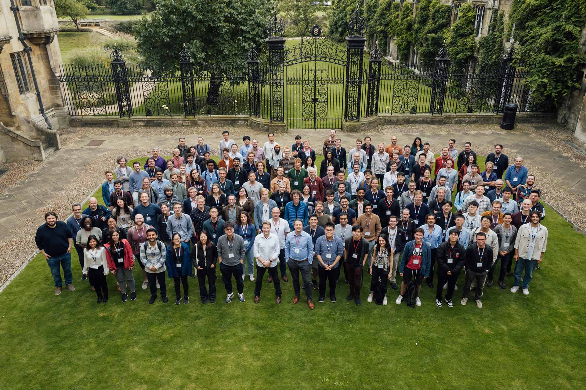 Event attendees pose for photo on lawn