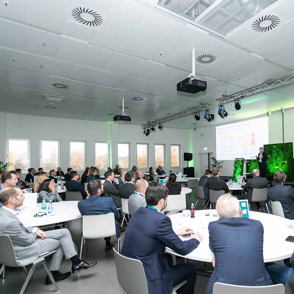 Group of people sitting listening to talk at conference