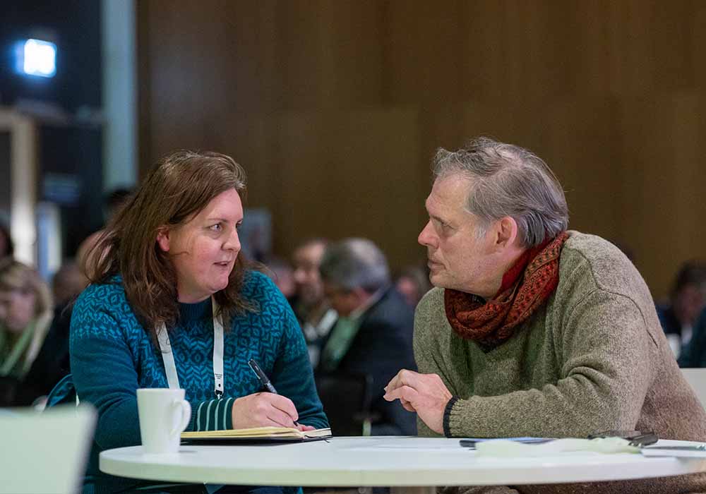 People in conversation at 100 together