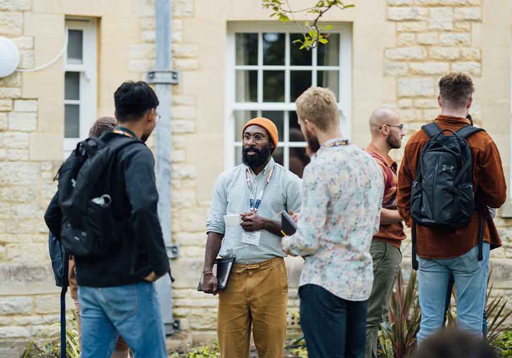 People in conversation at event